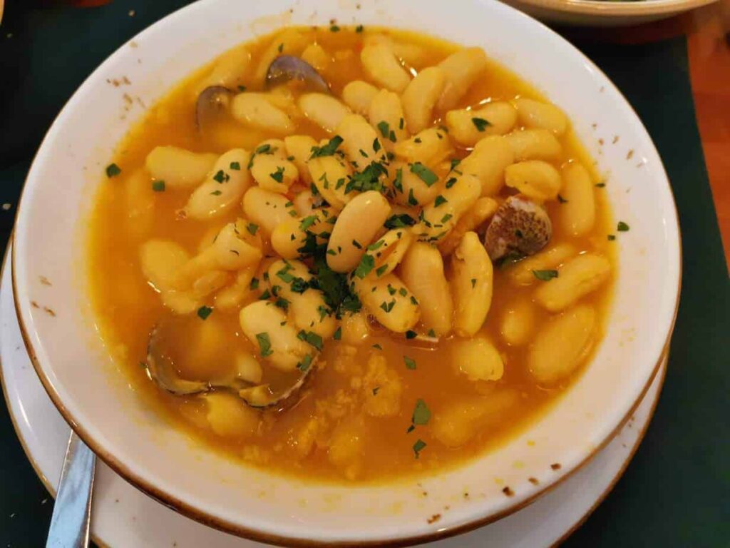 fabada asturiana, one of the local dishes in asturias - a must try when visiting the region.