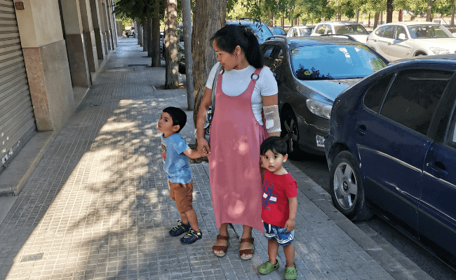 a photo of a mother wearing a long comfortable jumper dress with a white tee underneath - one of the reasons why I started dressing modestly