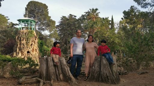 a photo of a family on a park enjoying the slow travel way instead of rushing to see the entire place
